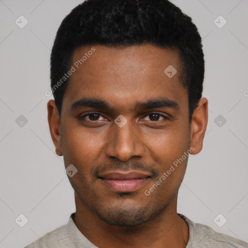 Joyful black young-adult male with short  black hair and brown eyes