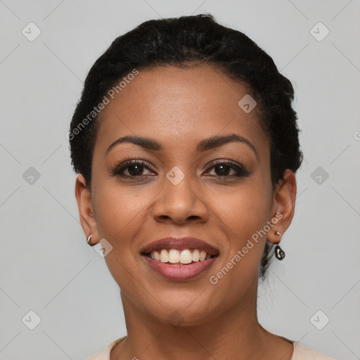 Joyful black young-adult female with short  black hair and brown eyes