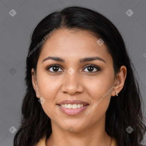 Joyful latino young-adult female with long  brown hair and brown eyes