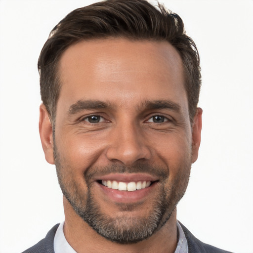 Joyful white young-adult male with short  brown hair and brown eyes