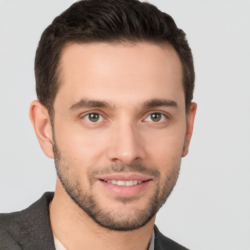 Joyful white young-adult male with short  brown hair and brown eyes