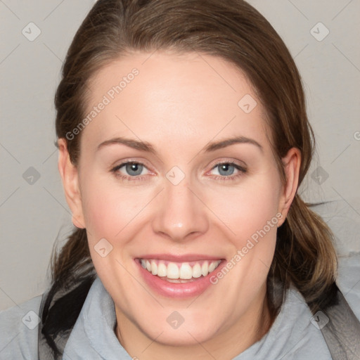 Joyful white young-adult female with medium  brown hair and blue eyes