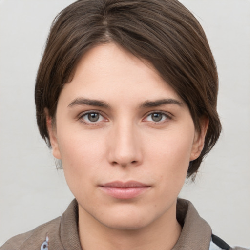 Neutral white young-adult female with short  brown hair and brown eyes