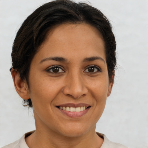 Joyful white young-adult female with short  brown hair and brown eyes