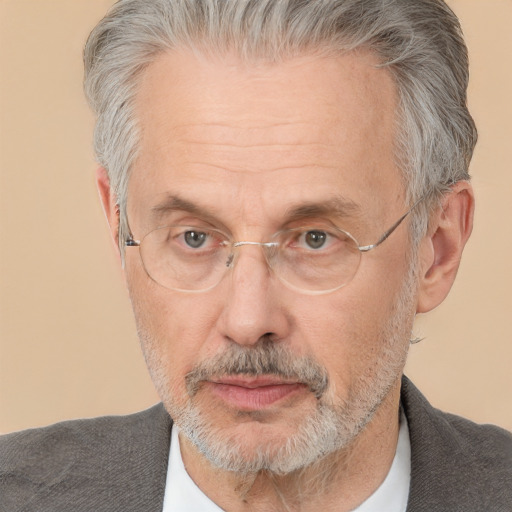 Neutral white middle-aged male with short  gray hair and brown eyes