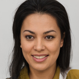 Joyful asian young-adult female with long  brown hair and brown eyes