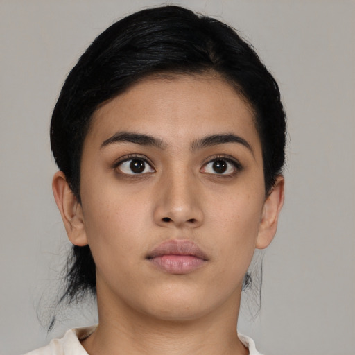 Neutral latino young-adult female with medium  black hair and brown eyes