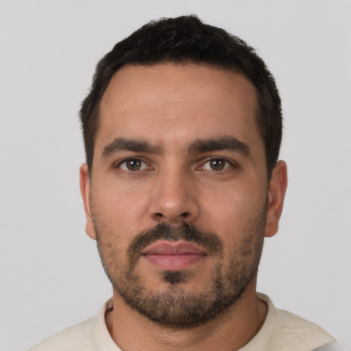 Neutral white young-adult male with short  black hair and brown eyes