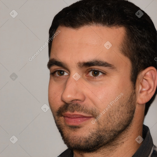 Joyful white young-adult male with short  black hair and brown eyes