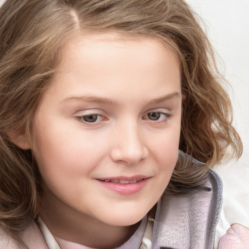 Joyful white child female with medium  brown hair and blue eyes