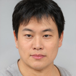 Neutral asian young-adult male with short  brown hair and brown eyes