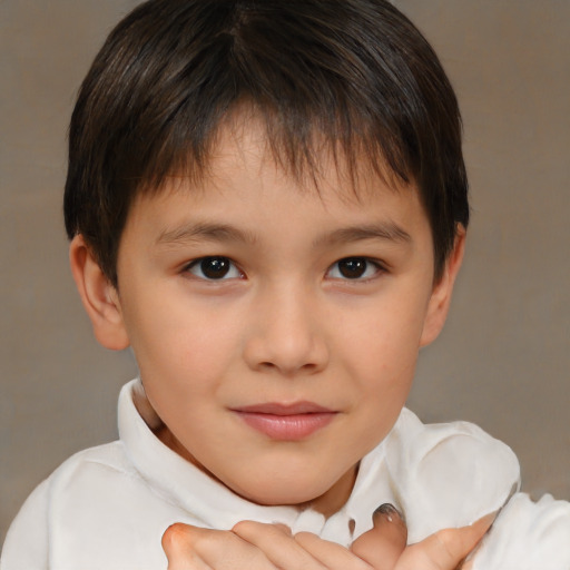 Joyful white child female with short  brown hair and brown eyes