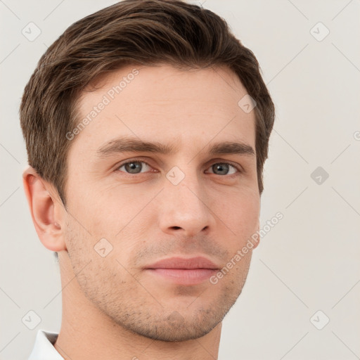 Neutral white young-adult male with short  brown hair and grey eyes