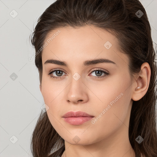 Neutral white young-adult female with long  brown hair and brown eyes