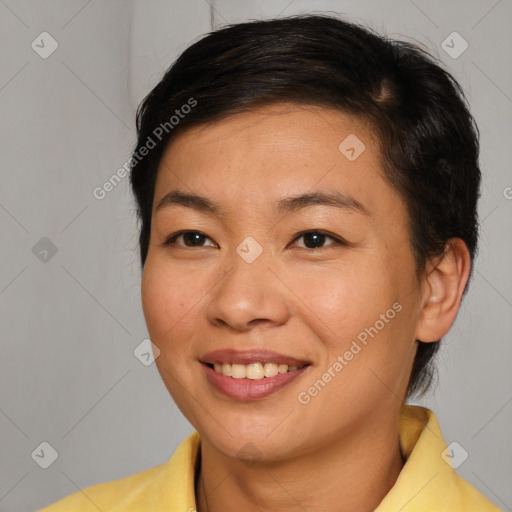 Joyful asian young-adult female with medium  brown hair and brown eyes