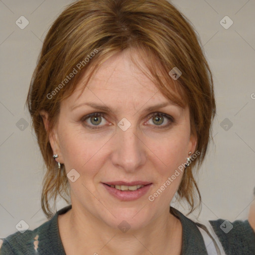 Joyful white adult female with medium  brown hair and blue eyes