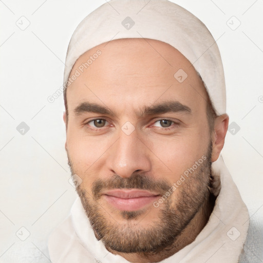 Joyful white young-adult male with short  brown hair and brown eyes