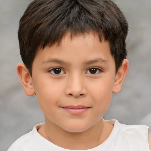 Joyful white child male with short  brown hair and brown eyes