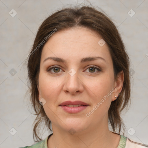 Joyful white young-adult female with medium  brown hair and green eyes