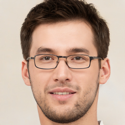 Joyful white young-adult male with short  brown hair and brown eyes