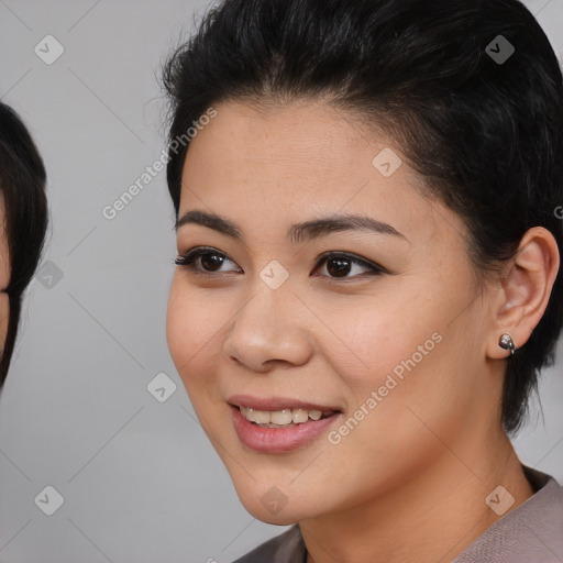 Joyful asian young-adult female with medium  black hair and brown eyes