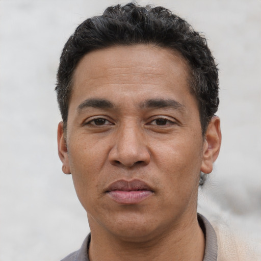 Neutral asian adult male with short  brown hair and brown eyes