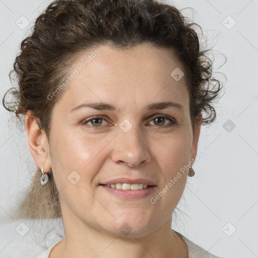 Joyful white adult female with short  brown hair and grey eyes