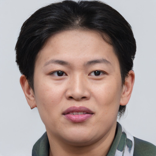 Joyful asian adult female with short  brown hair and brown eyes