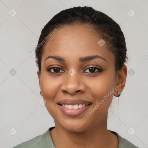 Joyful latino young-adult female with short  black hair and brown eyes