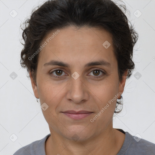 Joyful white adult female with short  brown hair and brown eyes