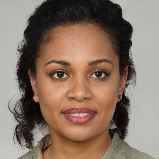 Joyful latino young-adult female with medium  brown hair and brown eyes