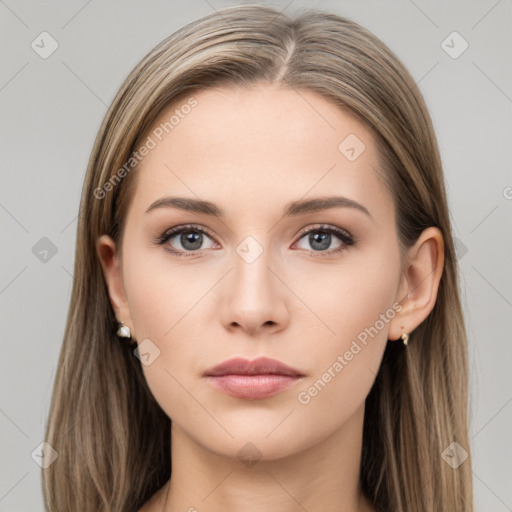 Neutral white young-adult female with long  brown hair and brown eyes