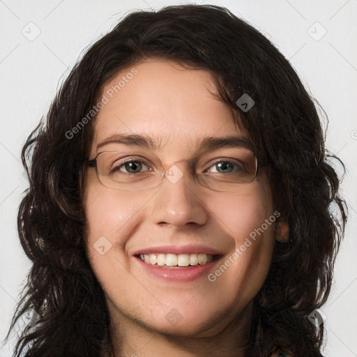 Joyful white young-adult female with long  brown hair and green eyes