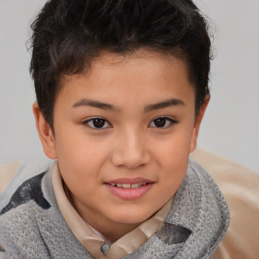 Joyful asian child female with short  brown hair and brown eyes