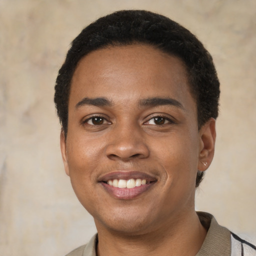 Joyful black young-adult male with short  black hair and brown eyes