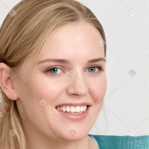 Joyful white young-adult female with long  brown hair and blue eyes