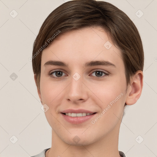 Joyful white young-adult female with short  brown hair and grey eyes