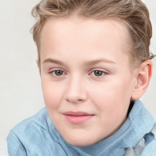 Joyful white child female with short  brown hair and blue eyes