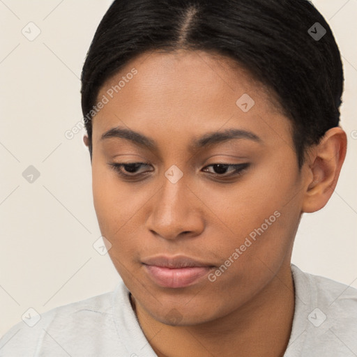 Joyful latino young-adult female with short  black hair and brown eyes