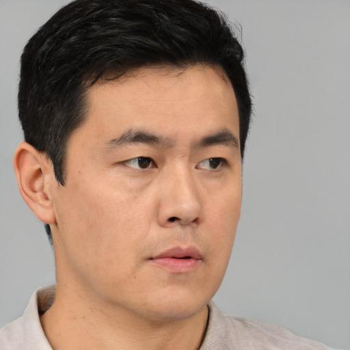 Neutral asian young-adult male with short  black hair and brown eyes