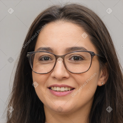 Joyful white adult female with long  brown hair and brown eyes