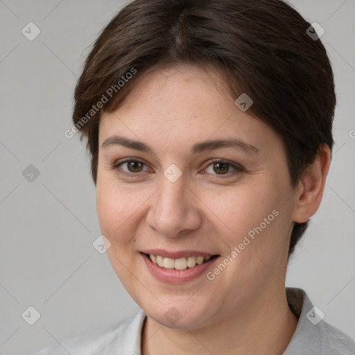 Joyful white young-adult female with short  brown hair and brown eyes