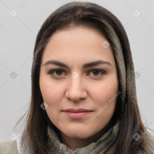 Joyful white young-adult female with long  brown hair and brown eyes