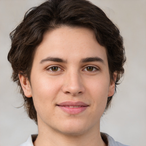 Joyful white young-adult male with medium  brown hair and brown eyes