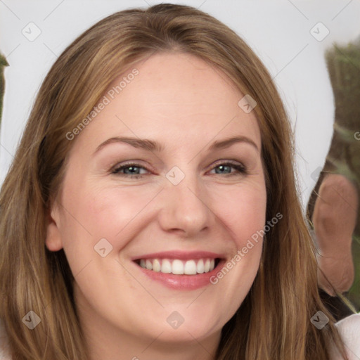 Joyful white young-adult female with long  brown hair and green eyes