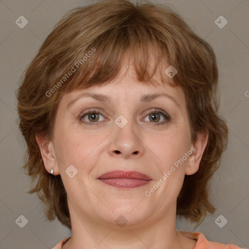 Joyful white adult female with medium  brown hair and grey eyes