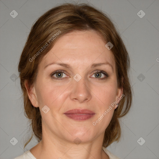 Joyful white adult female with medium  brown hair and blue eyes