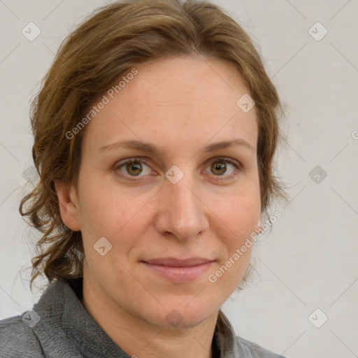 Joyful white adult female with medium  brown hair and blue eyes