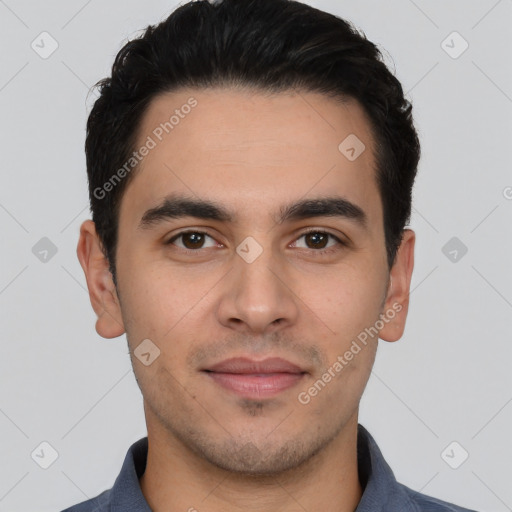 Joyful white young-adult male with short  black hair and brown eyes