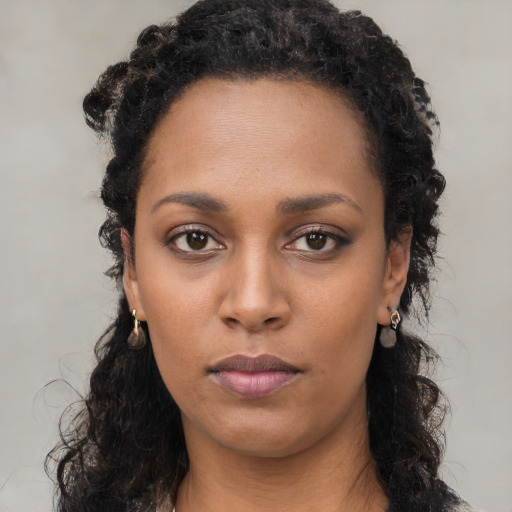 Neutral black young-adult female with long  black hair and brown eyes